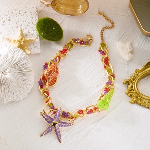 Bohemian ocean jewelry set with colorful starfish, shell and conch charms on gold chain