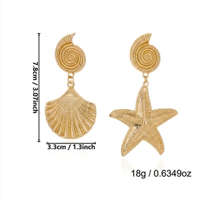 Detailed view of gold starfish and scallop shell earrings with size measurement labels