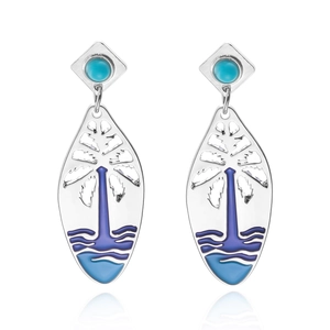 Detail view of silver drop earrings with blue stones and palm tree enamel patterns