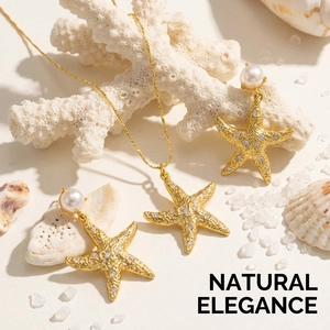 Detail of starfish jewelry set with pearls and zircons on a natural coral background