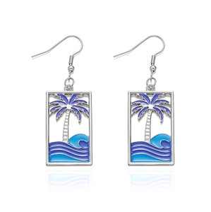 Detail view of rectangular drop earrings featuring tropical beach enamel art and fishhooks