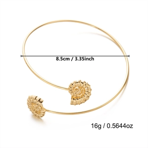 Detailed view of bohemian gold shell cuff bracelet with diameter and weight measurements