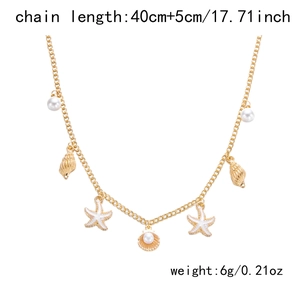 Detail of double-layer ocean necklace with seashell, starfish charms and white pearl