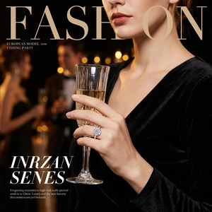 Detail of halo cluster ring with pavé diamonds worn by model holding champagne glass