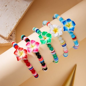 Set of five bohemian Plumeria beaded bracelets with colorful clay and crystal beads