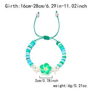 Detail of colorful clay bead bracelet with plumeria pendant and adjustable green cord