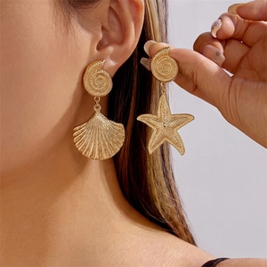 Golden asymmetrical ocean-themed drop earrings with starfish and seashell charms