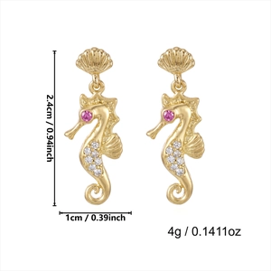 Detail showing golden seahorse earrings dimensions at 2.4cm height with crystal accents
