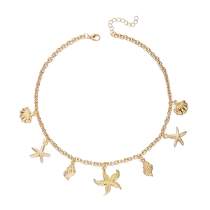 Double layered gold beach necklace featuring starfish and seashell pendants on white background