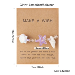 Detailansicht des Seestern- und Muschelarmbands auf einer Make a Wish-Karte