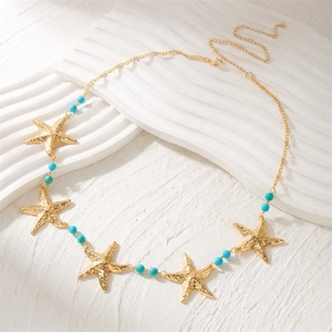 Chaîne de taille avec étoiles de mer dorées et perles turquoise de style marin