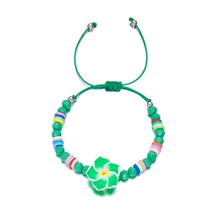 Detail of summer flower beaded bracelet with colorful clay discs and green faceted beads