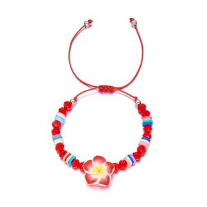 Detail of summer flower bracelet with red crystal beads and adjustable pull string