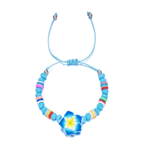 Blue plumeria flower beaded bracelet with colorful clay discs and adjustable rope cord
