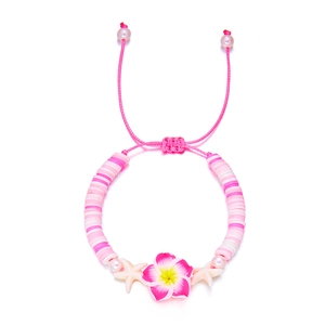 Detail of pink plumeria flower and starfish beads on bohemian adjustable bracelet