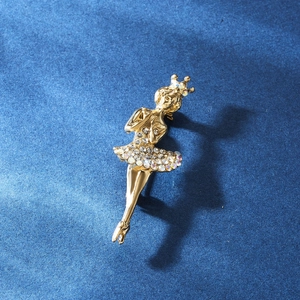 Detailed view of ballet dancer brooch with gold plating and sparkling crystal accents