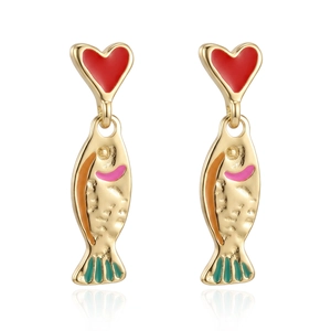 Detail of red heart and colorful fish drop earrings with gold plating and enamel finish
