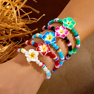 Five-piece set of Bohemian flower beaded bracelets with colorful plumeria flower charms
