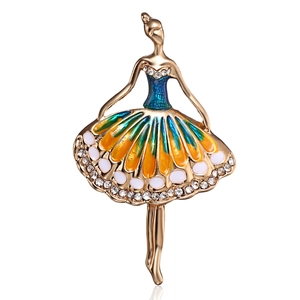 Detailed macro view of a ballet dancer brooch with colorful enamel and sparkling rhinestones
