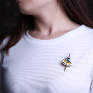 Close-up of ballet girl brooch with enamel gradient and sparkling white crystals