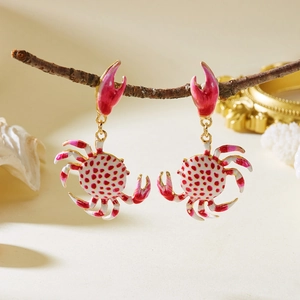 Chic ocean themed crab drop earrings with red polka dots and gold trim on branches