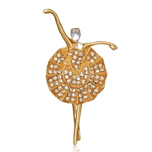 Elegant gold ballerina brooch with sparkling rhinestones and a pear-cut crystal accent