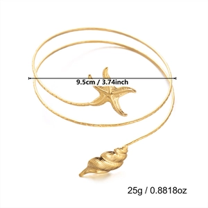 Bracelet de bras spirale doré bohème avec étoile de mer et coquillage pour l'été