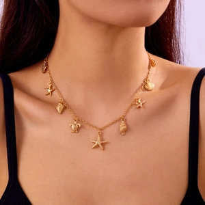 Golden double-layered ocean necklace with starfish, shell, and turtle charms