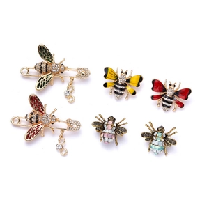 Detailed set of six bee brooches with enamel finish and sparkling crystal accents