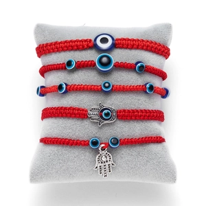 Five-piece set of handmade red string woven bracelets with Evil Eye and Hamsa charms