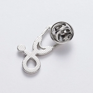 Detailed back view of silver stethoscope brooch with secure butterfly clasp closure