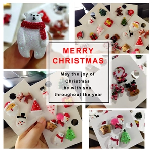 Christmas brooch set featuring festive resin icons like Santa and reindeer with glitter