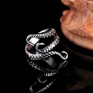 Macro shot of punk octopus tentacle ring with vintage silver suction cup textures