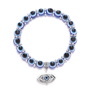 Detailed macro view of the evil eye beaded bracelet with silver cutout charm