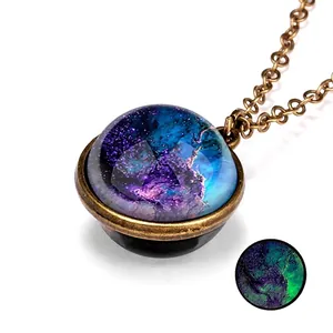 Luminous cosmic galaxy necklace with double-sided glass pendant in vintage bronze finish