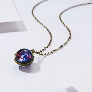 Retro bronze space galaxy necklace with glowing blue-purple nebula glass orb pendant