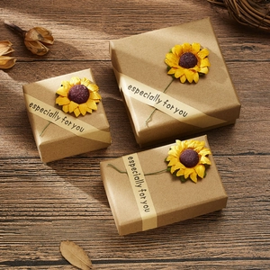 Three assorted sizes of kraft paper gift boxes with sunflowers and decorative sealing tape
