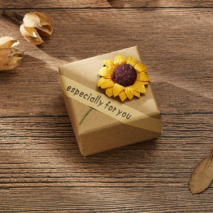 Macro shot of brown kraft jewelry box with sunflower decor and especially for you text