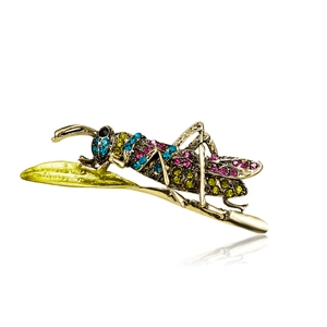 Detailed close-up of a golden alloy grasshopper brooch with colorful rhinestones