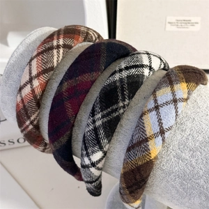 Detail of four vintage plaid padded sponge headbands showing soft texture and autumn colors