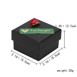 Detail view of square black jewelry box with red rose decoration and size specifications