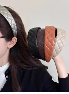 Close-up of quilted PU leather headbands in multiple colors including silver and brown