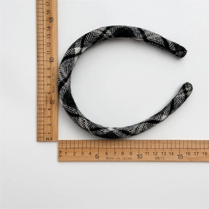 Detail showing measurement of the black and white plaid tweed headband with handmade label