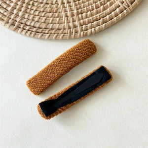 Pair of Korean style caramel knit fabric hair clips featuring diagonal woven textures