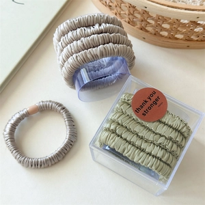 Set of 5 satin silk hair scrunchies in taupe and sage green with premium gift box packaging