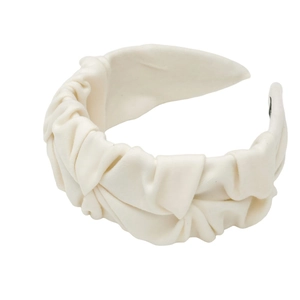 Minimalist cream white pleated wide headband with elegant fabric texture on white background