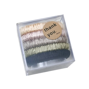 Set of 5 premium satin hair scrunchies in neutral colors packed in a clear acrylic box