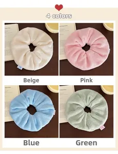 Close-up of four plush towel scrunchies in beige, pink, blue, and green set of 4 colors