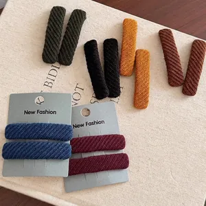 Set of 6 minimalist twill fabric hair clips in assorted earth tones on display card