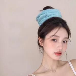 Sky blue coral fleece headband showing high elasticity and water absorption details